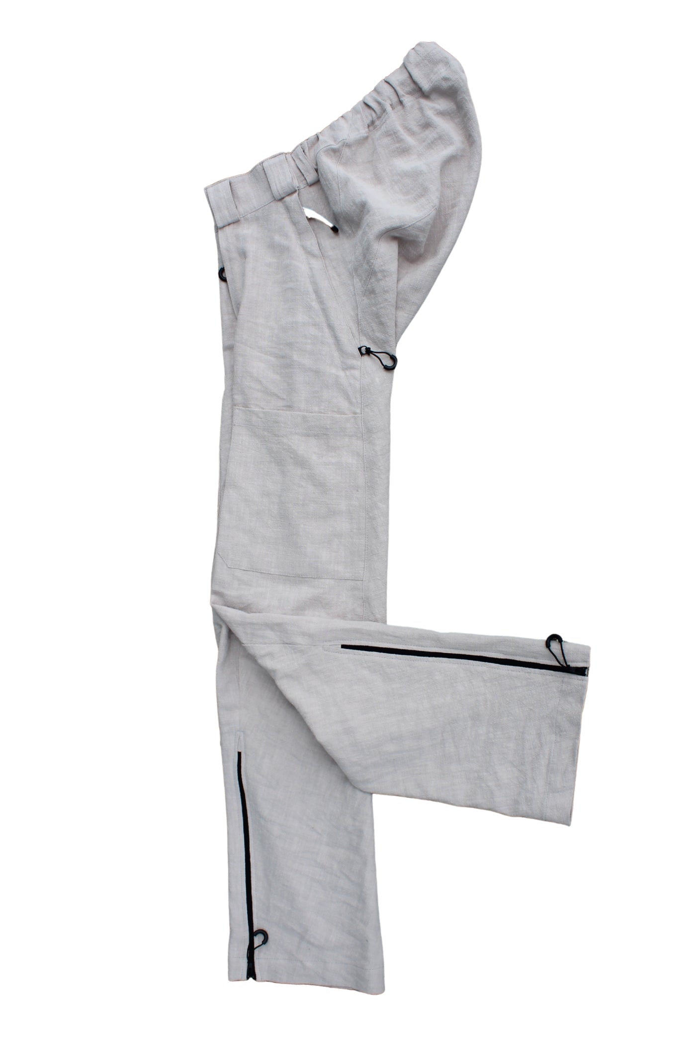 Side view of Vilber's adaptive trousers laid flat, showing the balanced side line and zip at the inner leg.