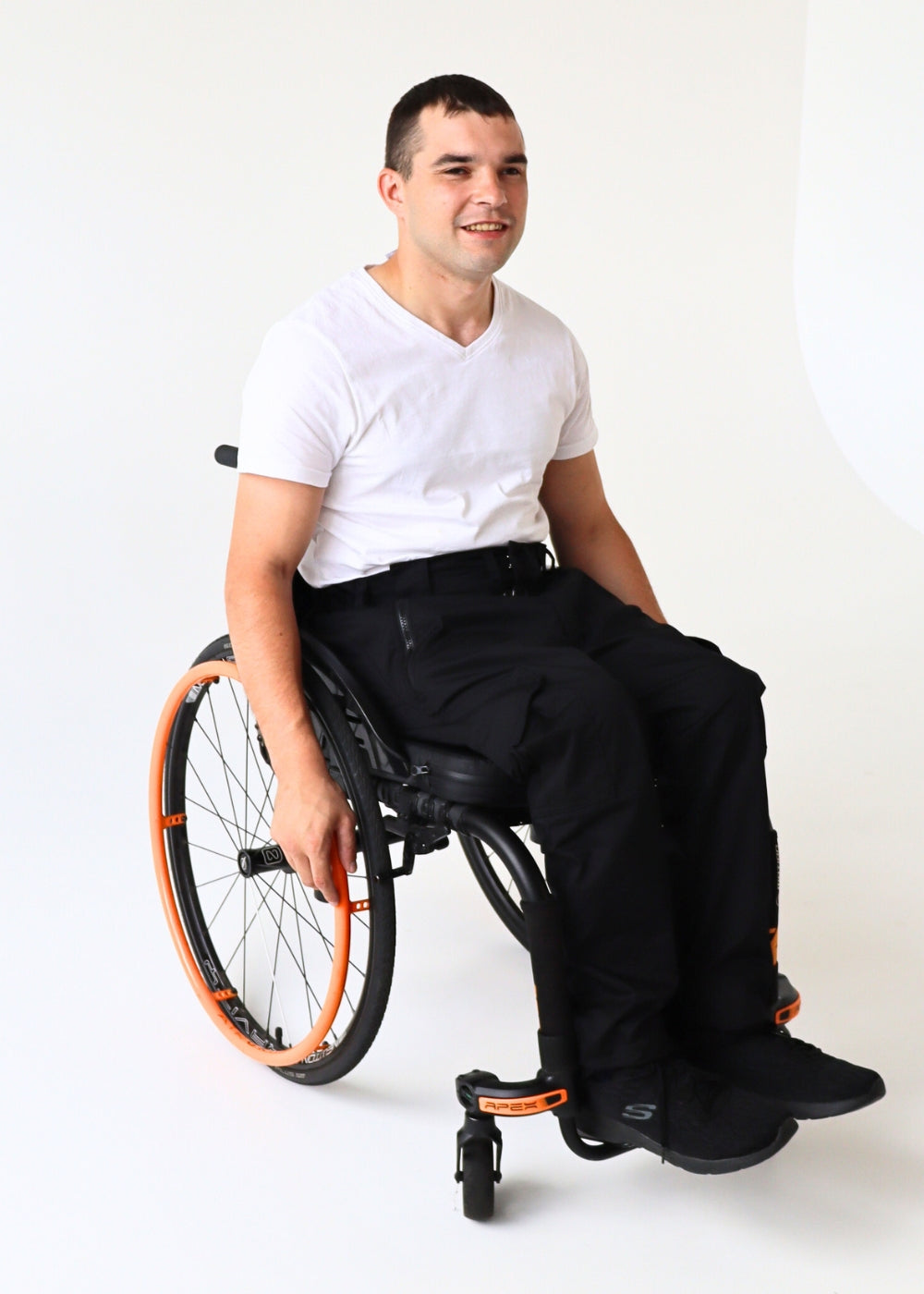 Black pants without pockets, wheelchair adapted