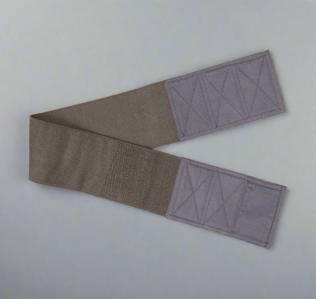 Wide elastic strap for keeping legs together for wheelchair users