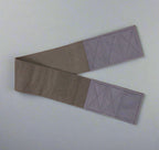 Wide elastic strap for keeping legs together for wheelchair users